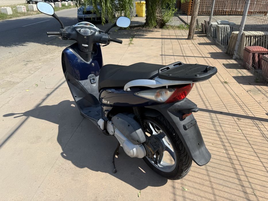 Honda sh 125i se conduce cu categoria B