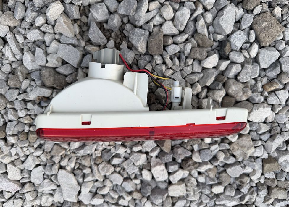 Оригинален ляв стоп в бронята за Subaru Justy / Suzuki Ignis