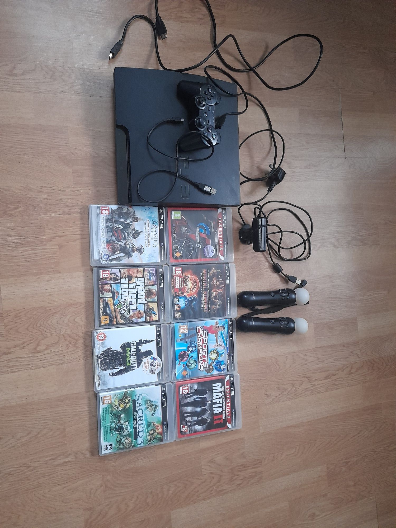 Playstation 3 slim+ 8 jocuri+o maneta+camera+2 manete jocuri sport