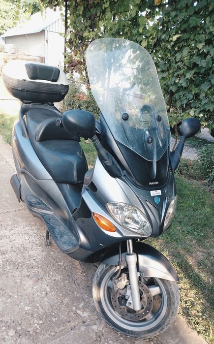 Vând Piaggio X9  acte Italia