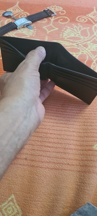 Pormoneu bărbați marca Michael kors .