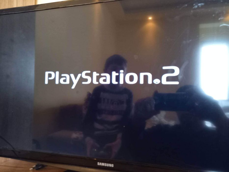 PlayStation 2 Slim с три игри