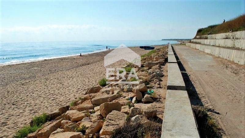 Regulated plot with building permit for complex of houses near the sea