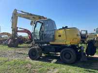 Dezmembrez excavator pe roti NEW HOLLAND MH Plus