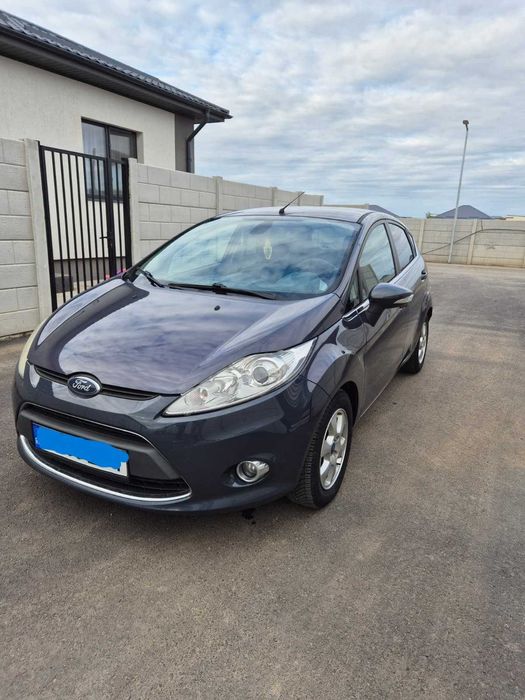 Ford Fiesta, 4 usi, 1,6l, 2011, 96 cp