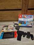 Vand Nintendo switch cu accesorii și 2 jocuri
