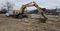 Caterpillar 206 BFT excavator pe roti