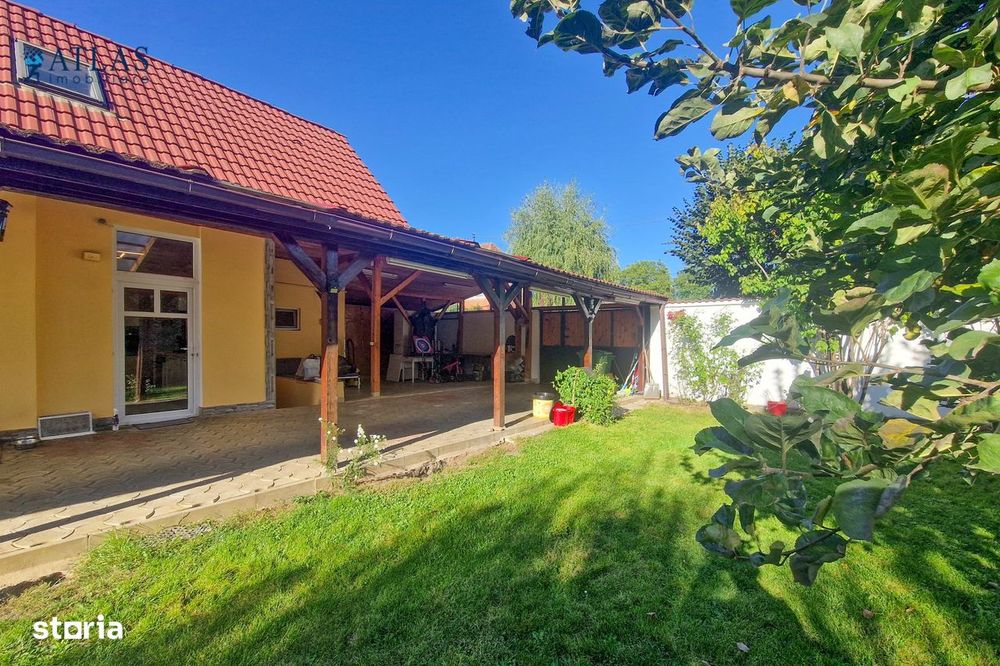 Casa, 4 camere, gradina superba de 770 mp., parcare acoperita in curte