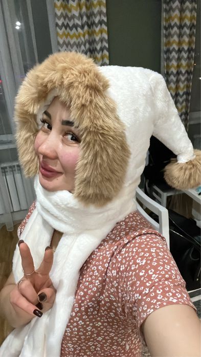 Продам новую шапку пркупплп дочери новая теплая  и не ношенная при