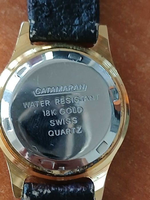 ceas Catmaran aur 18 k water resist swiss quartz