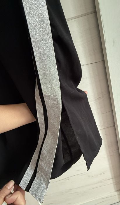 Pantaloni cu crac larg