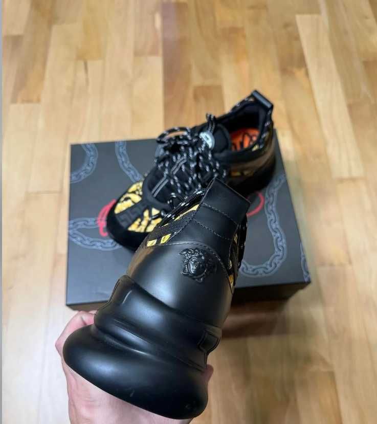 Versace chain reaction black and gold