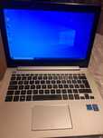 Laptop Asus cu ecran tactil funcțional