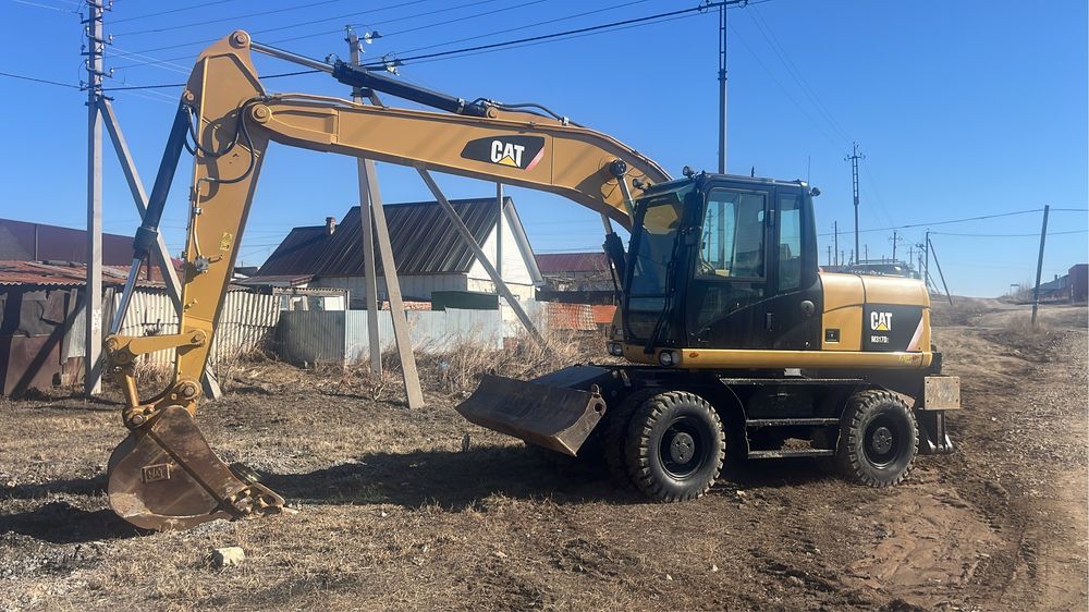 Колесный экскаватор