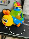 Музикална играчка с топки и въже за дърпане - WinFun охлювче, пумпал