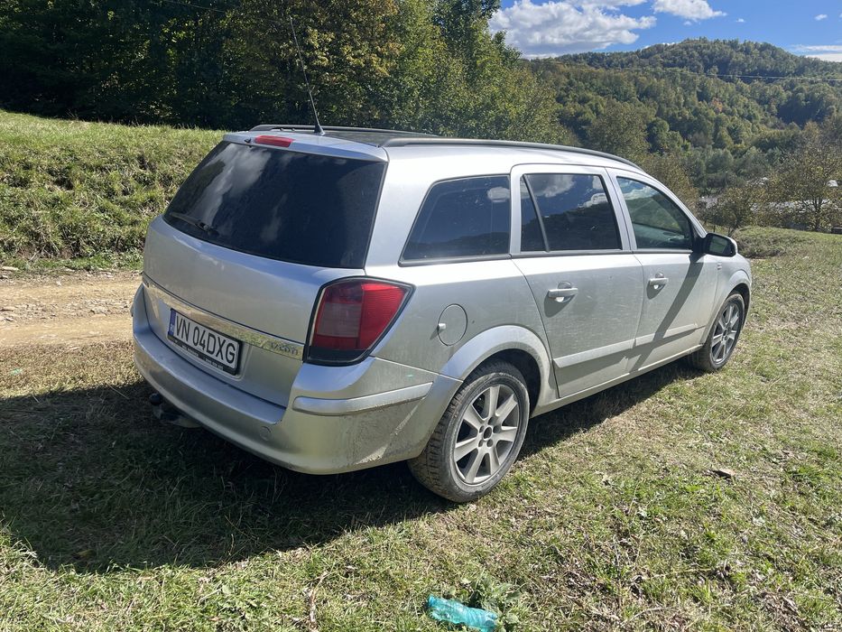 Vand sau schimb opel asta h  pret :2300€