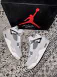 Jordan 4 frozen moments