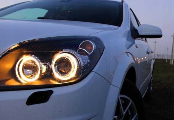 Faruri sport Opel Astra H GTC Twintop Angel Eyes look negru lupa NOU