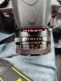 DSLR Nikon D3100, obiectiv de 50mm și ruxac Lowepro