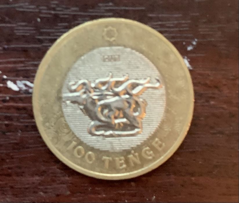 Продам каликционую манету в виде 100 тг
