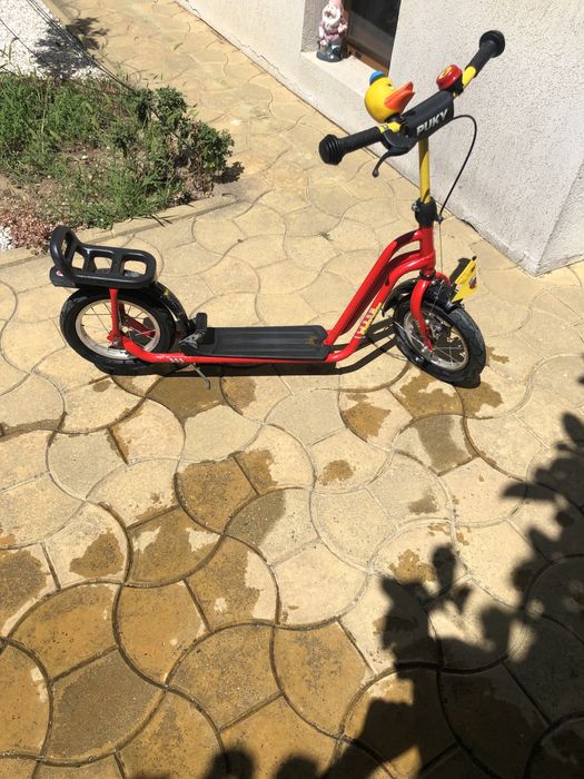 Trotineta copil , robusta ,folosita putin timp , roti gonflabile