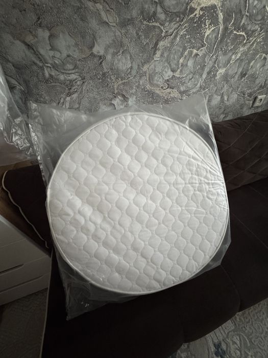 Продам новый матрас на круглую кроватку