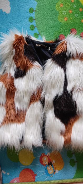 Пухен елек за дете