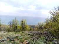Парцел с морска панорама на платото до голф игрищата