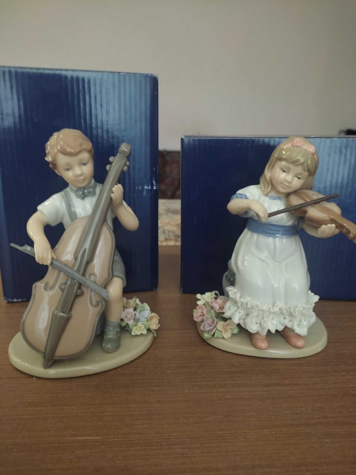 Cтатуэтки фарфоровые "Мальчик с виолончелью" и "Девочка со скрипкой"
