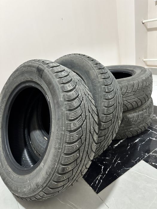 Продам новые шипованные шины 185/70/14