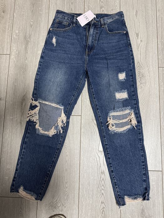 Дънки с накъсани крачоли