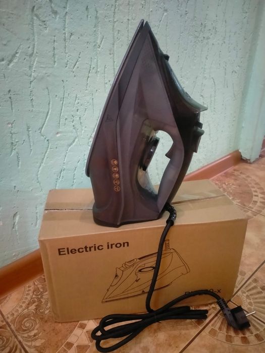 Продам большой новый утюг