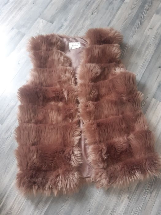 Пухен елек      .