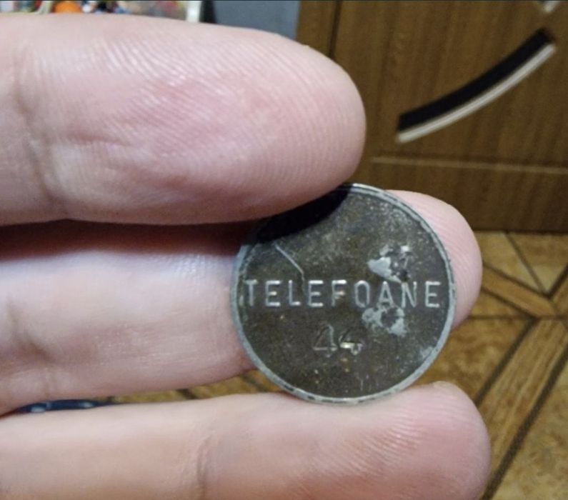 Jeton telefonic comunist România anii ’80, cu harta țării — simbol al