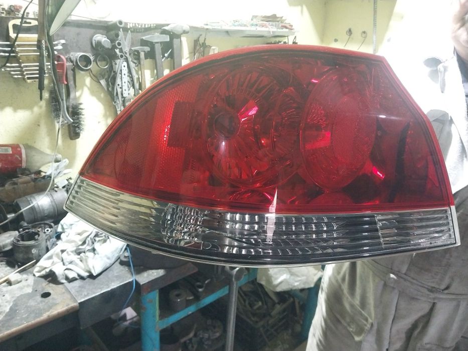 Фанарь задний левый автомашины Митцубиси Лансер