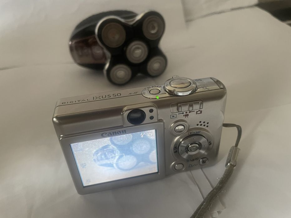 Canon Ixus 50 ,metal , made in Japan, afisaj data ora pe poze