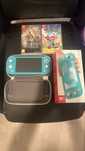 Nintendo switch lite + 2 jocuri + husa calatorie