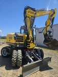 Excavator pe roti Neuson rototilt
