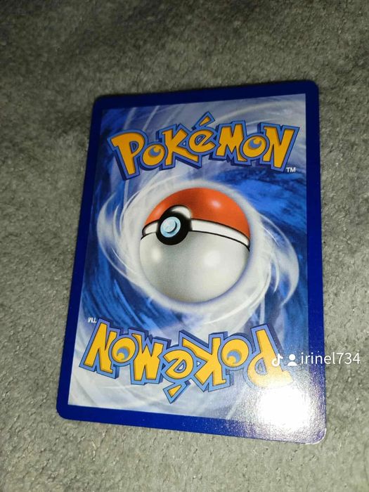 Pokemon cards, 1 Charizard, 1 Roaring Moon pret 100 Ron negociabil