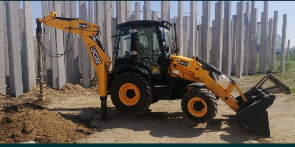 Услуги экскаватора-погрузчика, гидромолота, ямобура