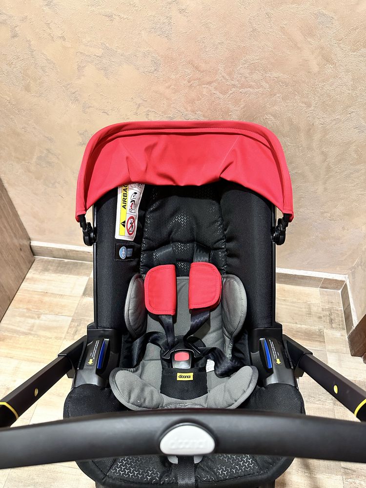 Doona столче за кола с шаси 2 в 1 flame red
