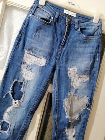Модные рваные джинсы женские