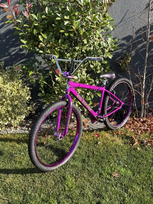 SE bike wheelie , purple rain