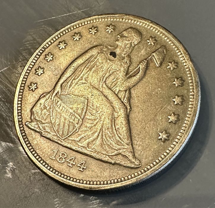 Moneda one dollars 1884