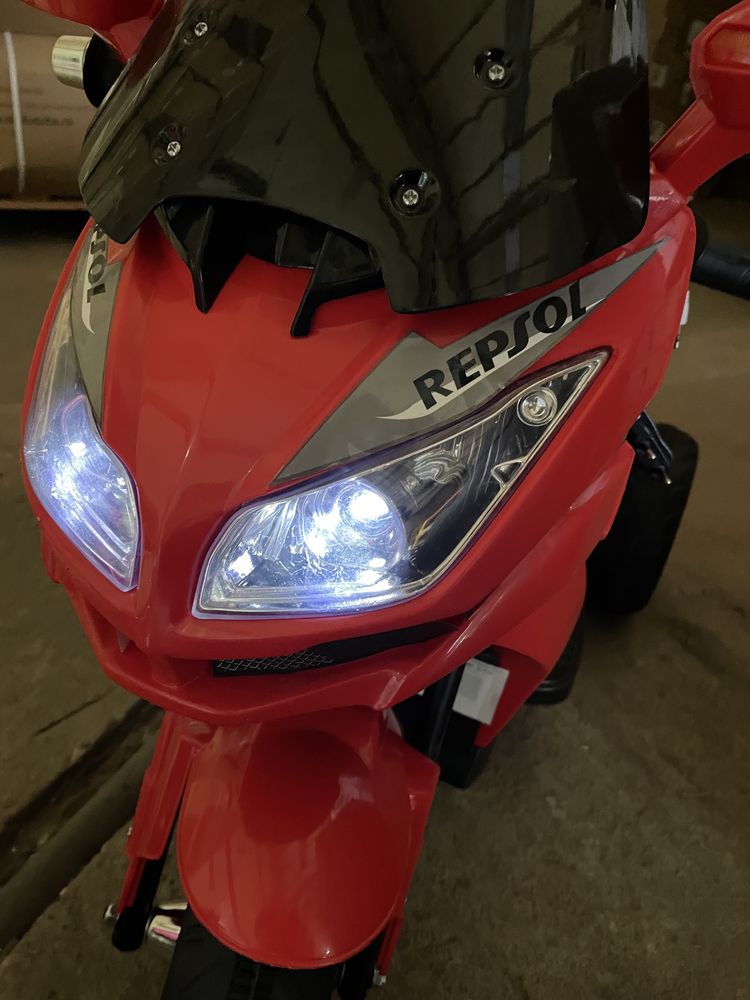 Motocicleta electrica cu lumini Flash Repsol