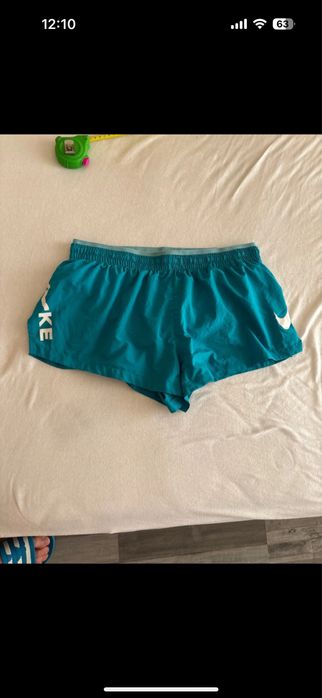 Pantaloni scurti de fete Nike running  dri-fit cu buzunar in spate