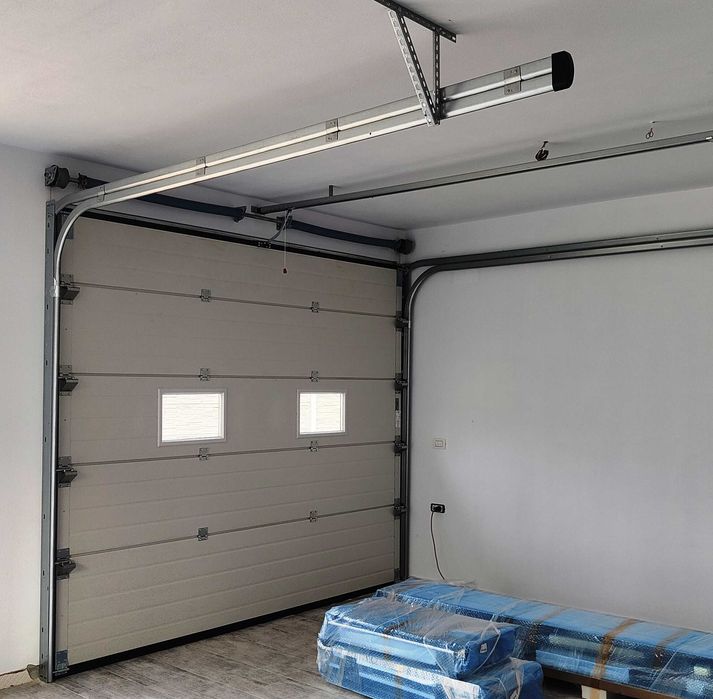Montaj usi garaj sectionale, automatizari porti, preturi producator