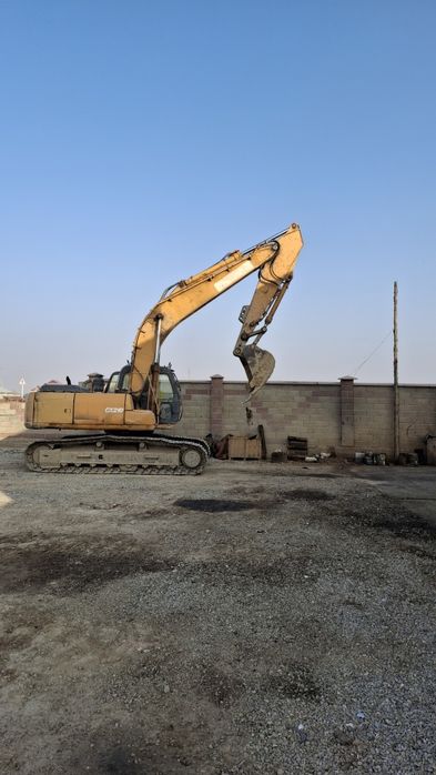 Услуги экскаватора кейс 210