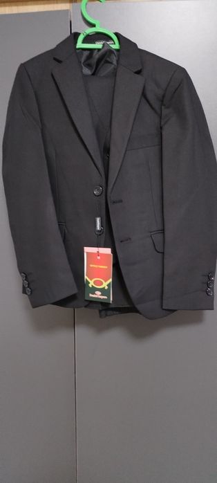 Продам новый костюм