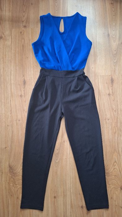 Дамски ефектен гащеризон с ластик на талията и деколте